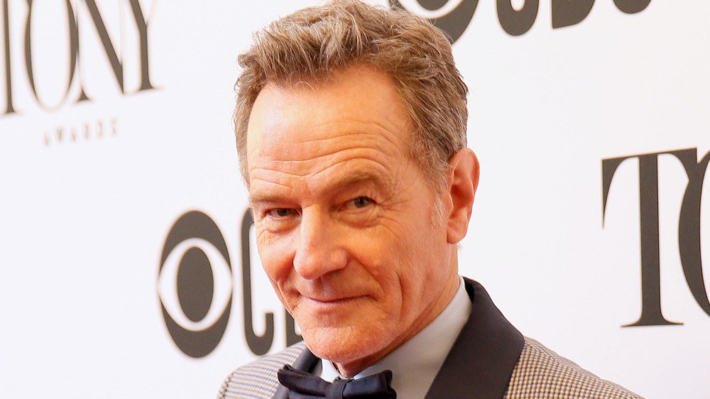 Cranston poses with Tony award