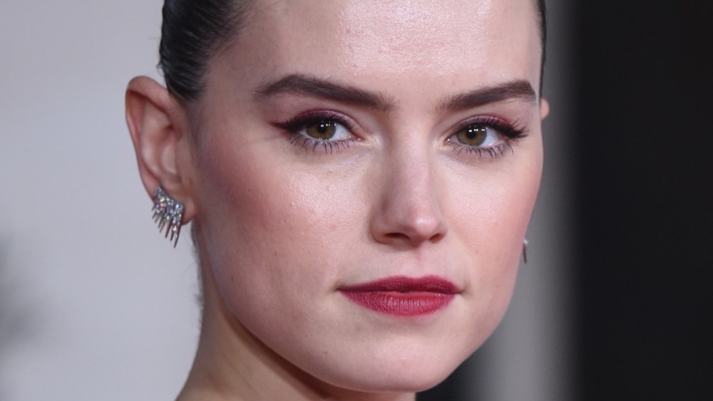 Daisy Ridley wears earrings