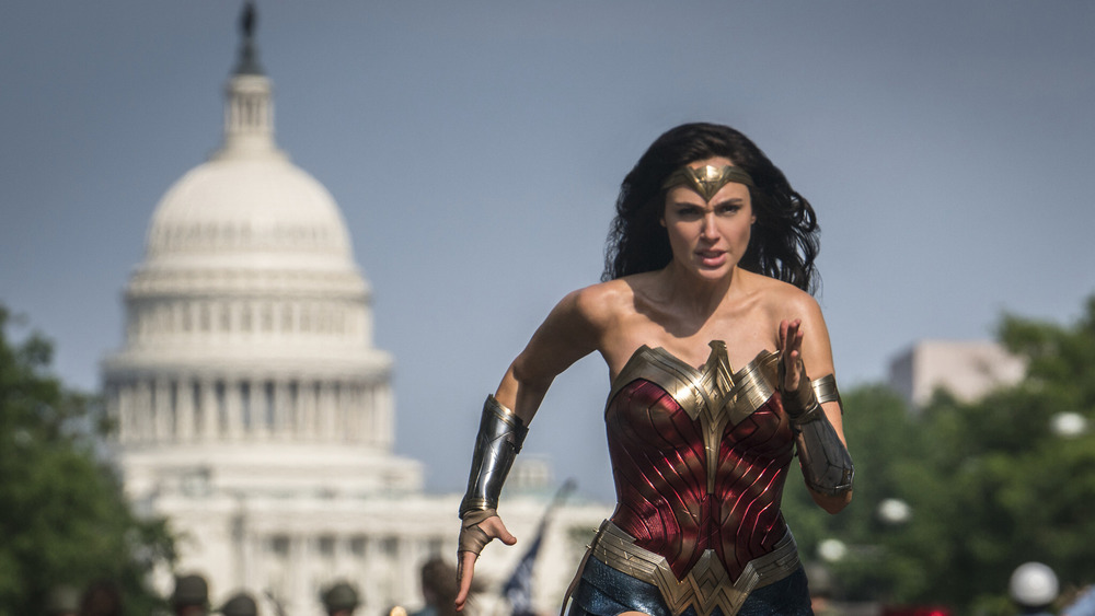 Gal Gadot running in front of the Washington DC Capitol Building in Wonder Woman 1984