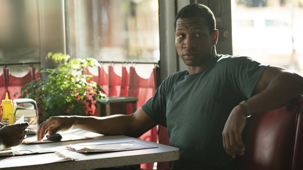 Atticus (Jonathan Majors) visits a diner