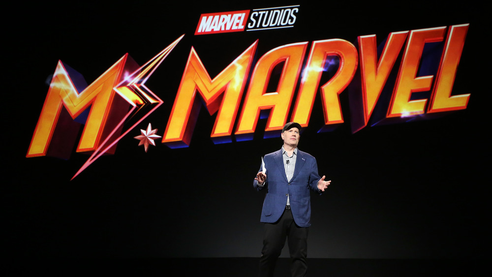 Kevin Feige with Ms. Marvel logo