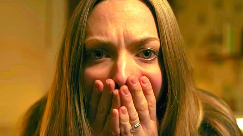 Catherine Clare scared hands on face