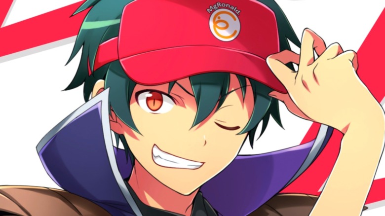 Sadao smiling and tipping cap