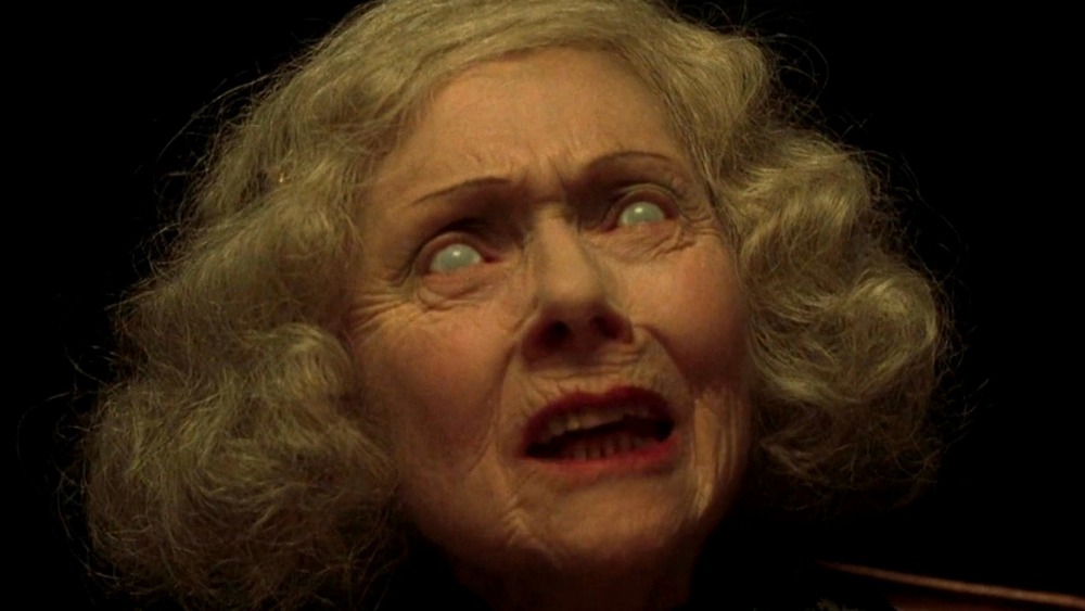 Old lady performing séance