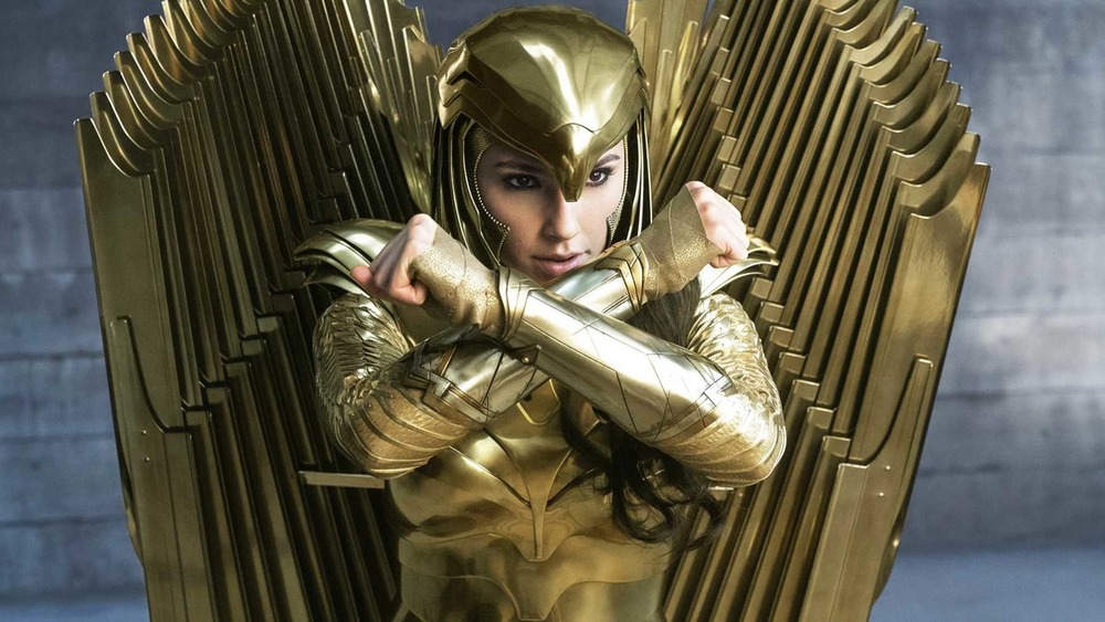 Wonder Woman in gold armor with arms crossed
