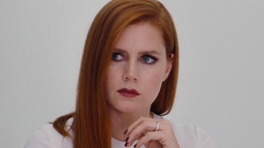 Amy Adams looks off-screen nervously