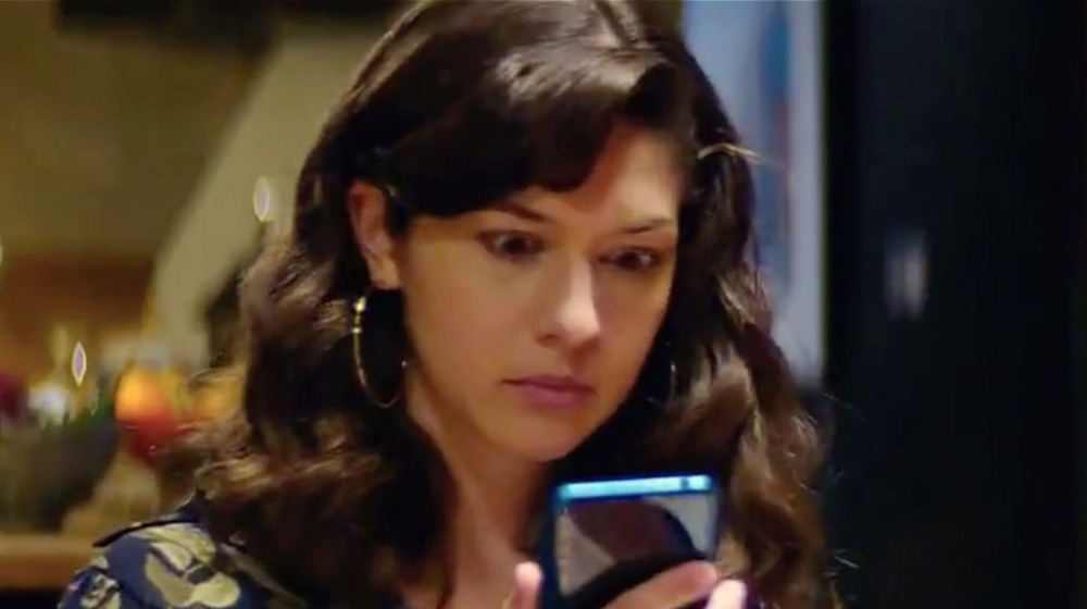 Woman staring at phone